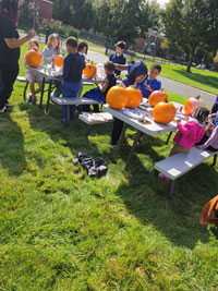 Children painting pumpkins